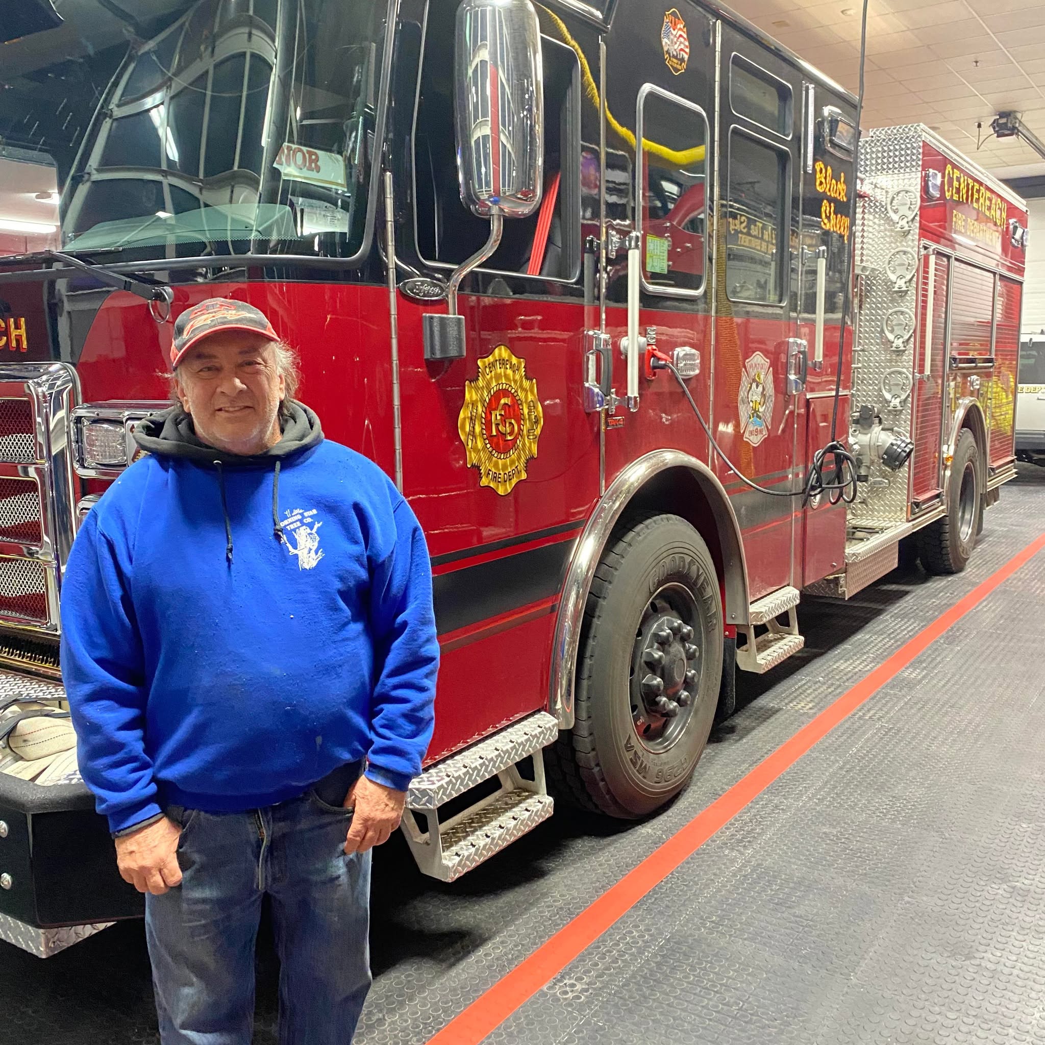 Mark Wm. Skowron in front of Centereach Fire Department Engine